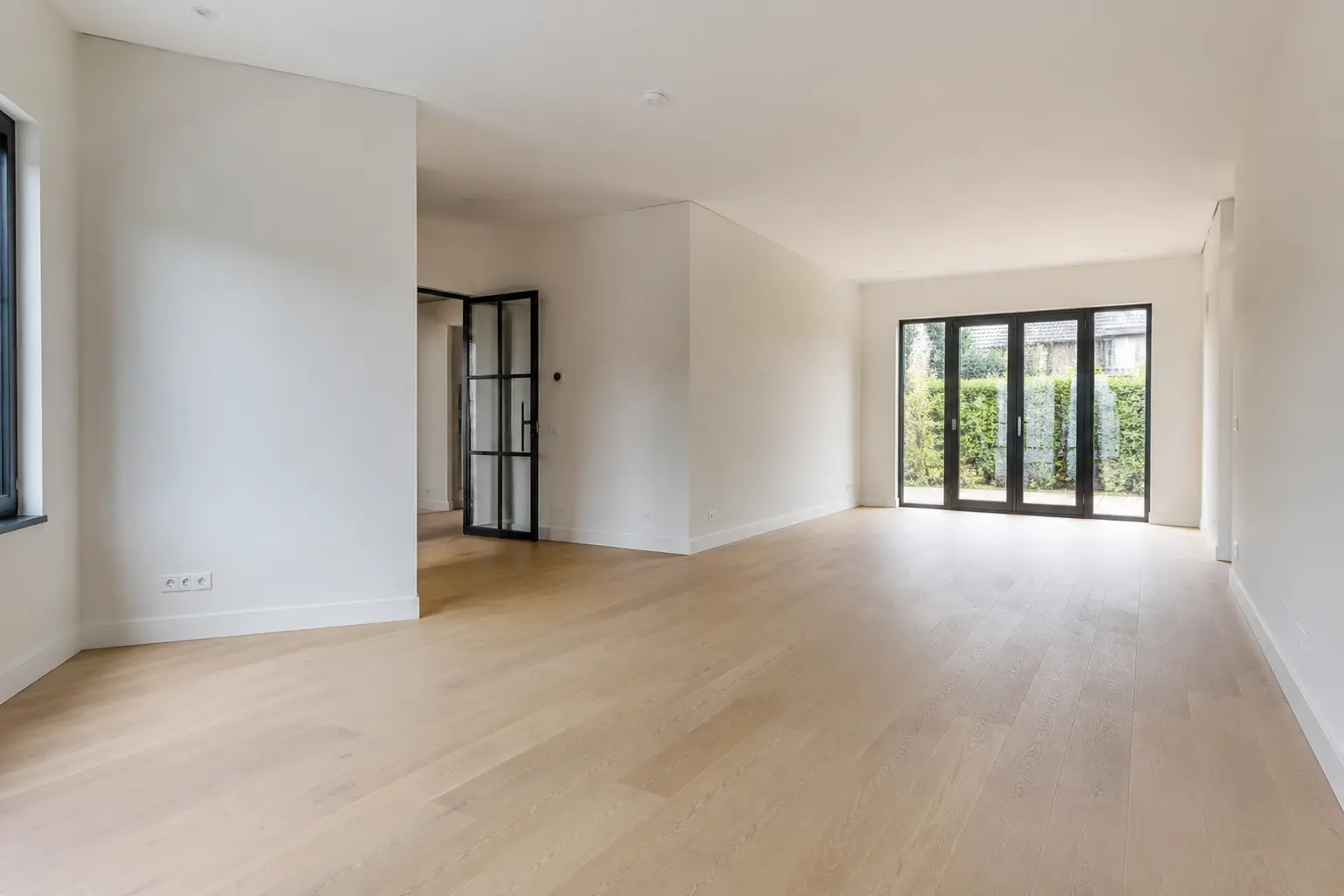 Original open-plan living and dining area before virtual staging