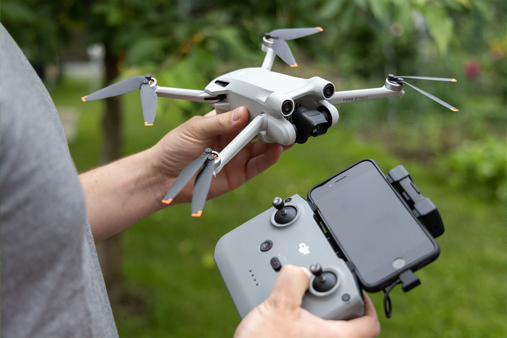 A Boykeys specialist holds a drone and remote control ready for a property shoot