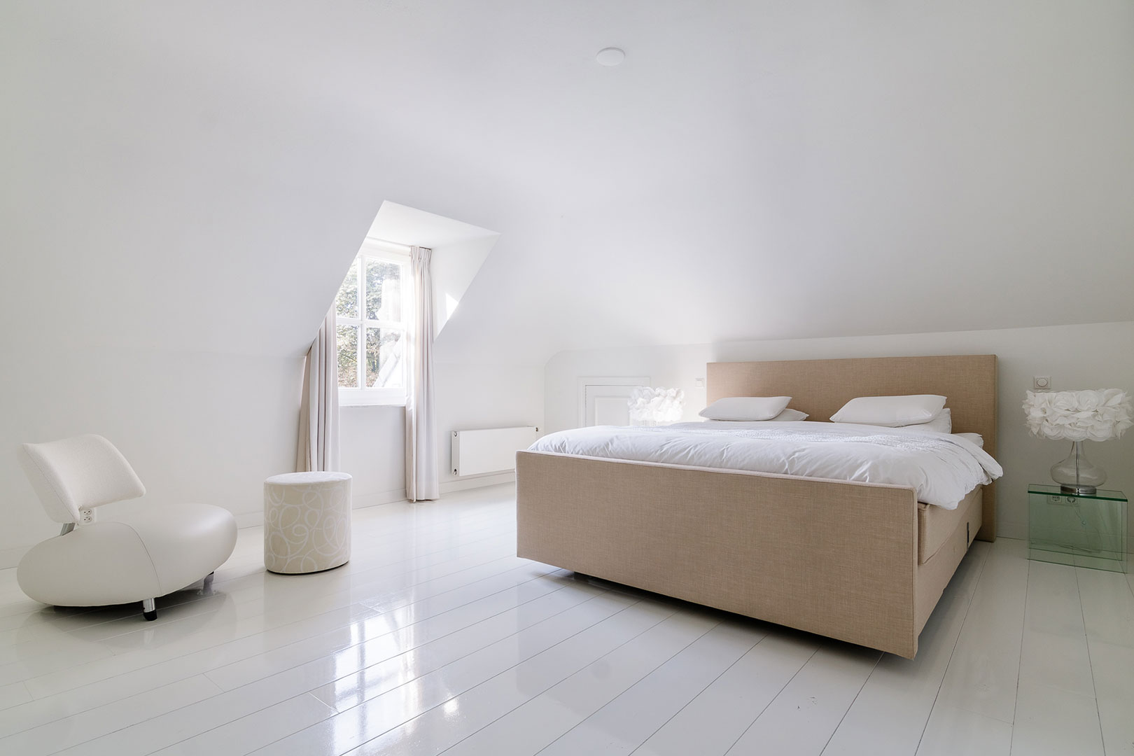 Peaceful bedroom with a neatly made double bed