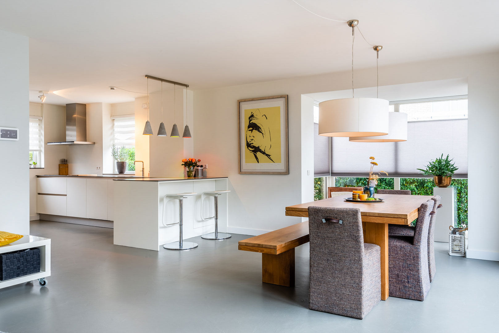 Open-plan kitchen-diner and dining room with large windows
